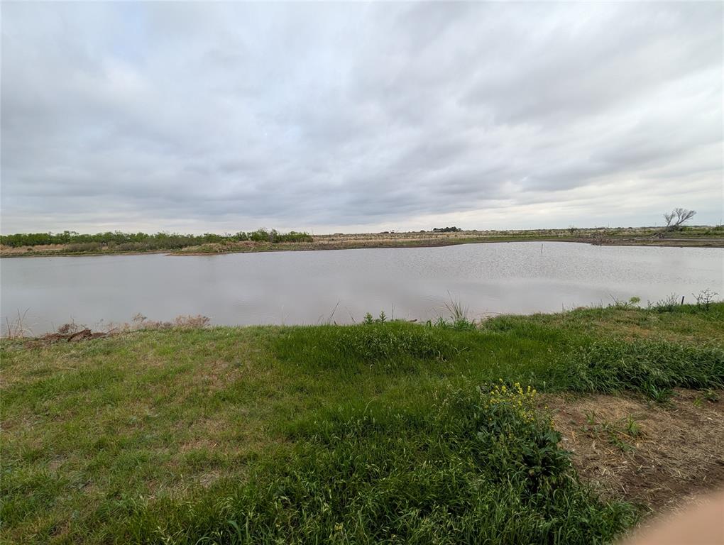 613 North Access Road Merkel, TX 79536 - Photo 3 of 11 a view of a lake from a yard