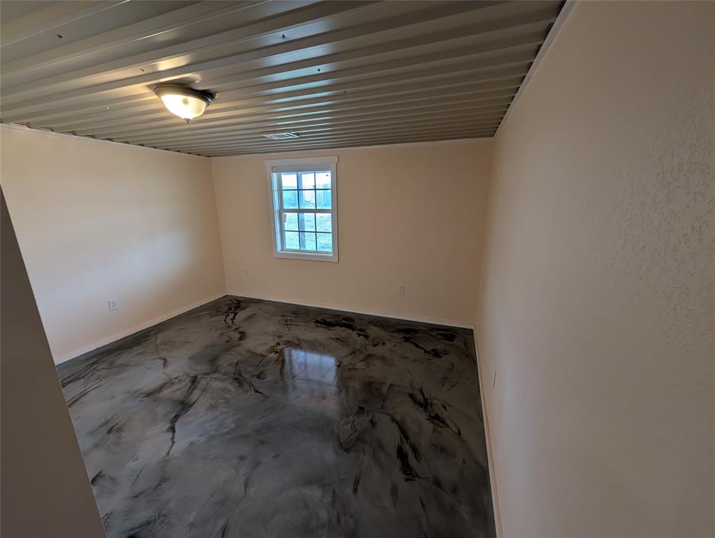 613 North Access Road Merkel, TX 79536 - Photo 9 of 11 an empty room with windows