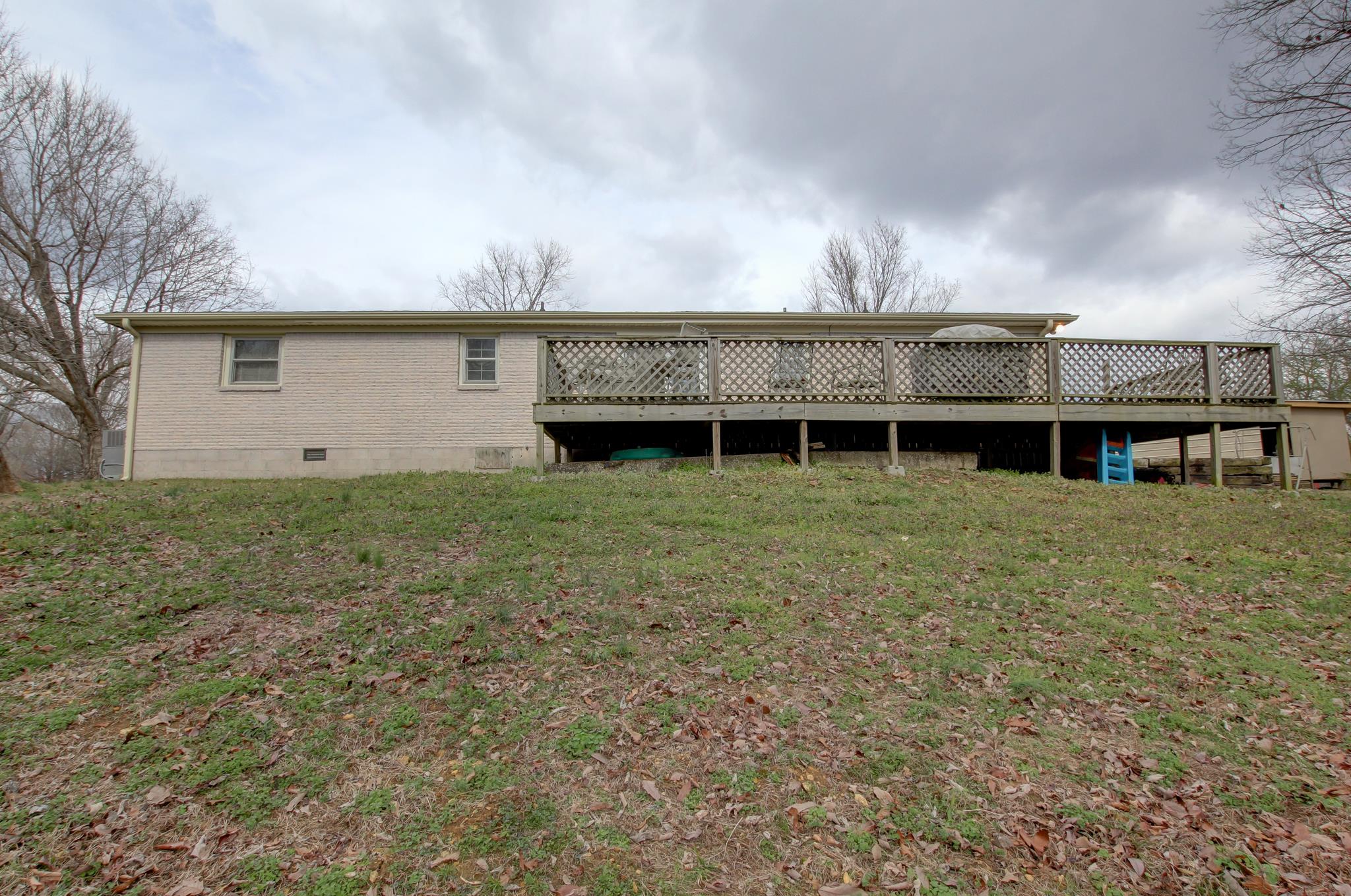 35 Locust Road Erin, TN 37061 - Photo 19 of 20 a view of a house with a yard and wooden fence
