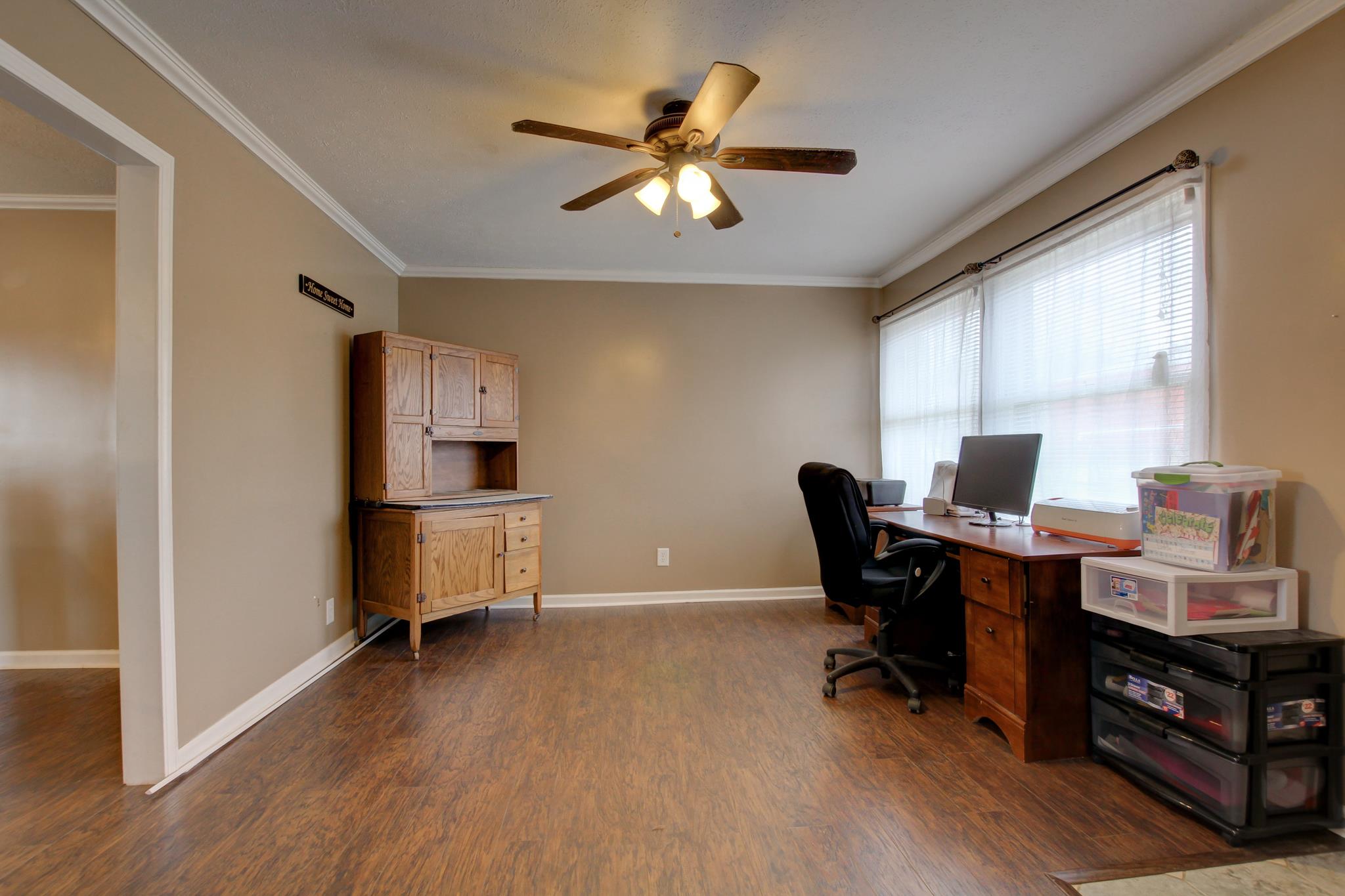35 Locust Road Erin, TN 37061 - Photo 2 of 20 a workspace with wooden floor and a window