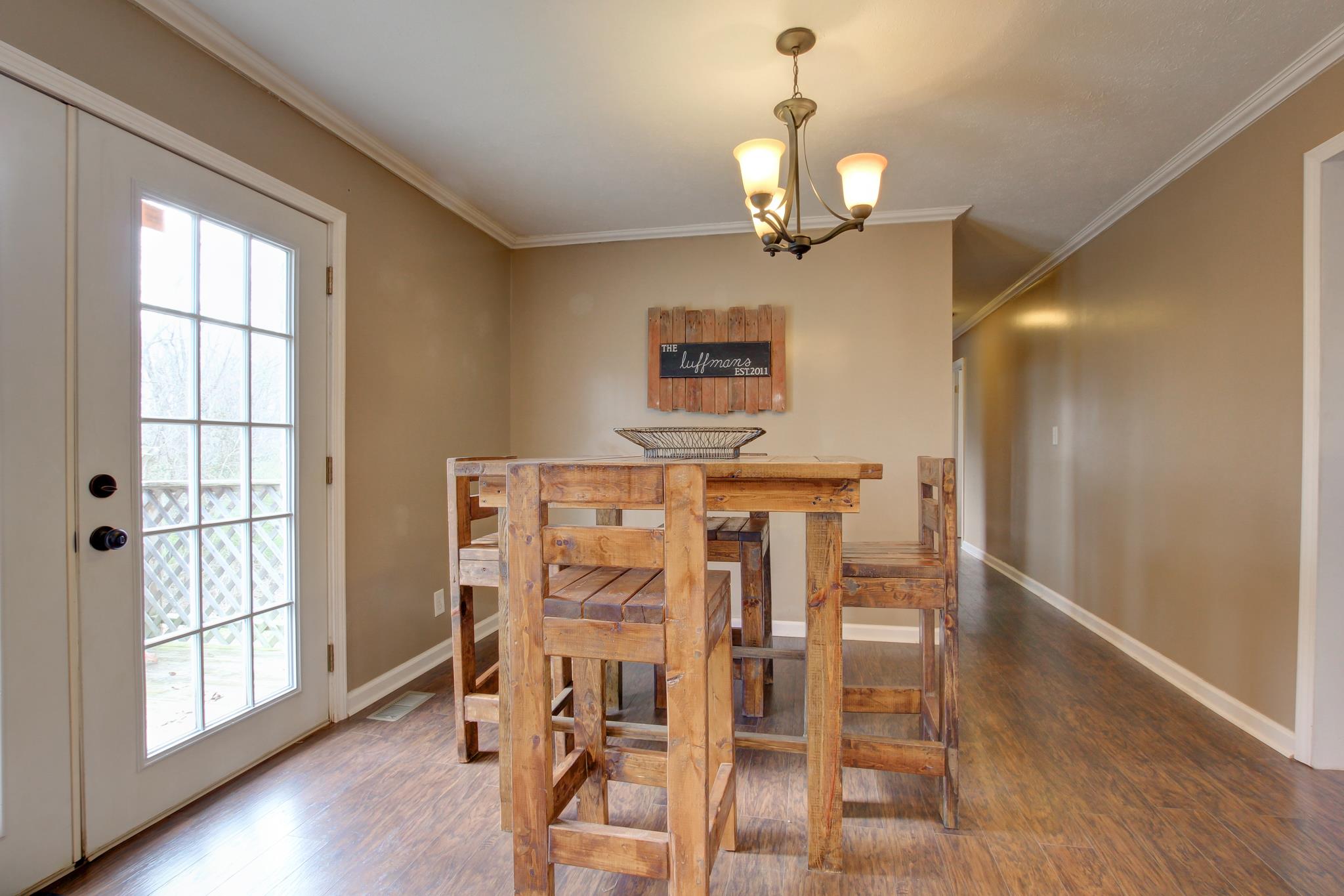 35 Locust Road Erin, TN 37061 - Photo 7 of 20 a view of a dining room with furniture and wooden floor