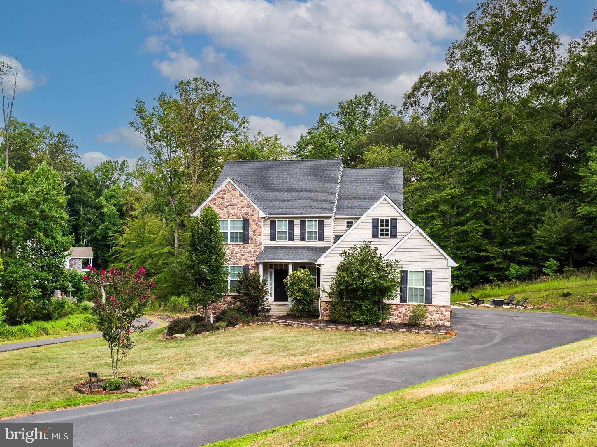 1718 Bethel Road Garnet Valley, PA 19060 - Photo 1 of 58 a front view of a house with a yard and garage