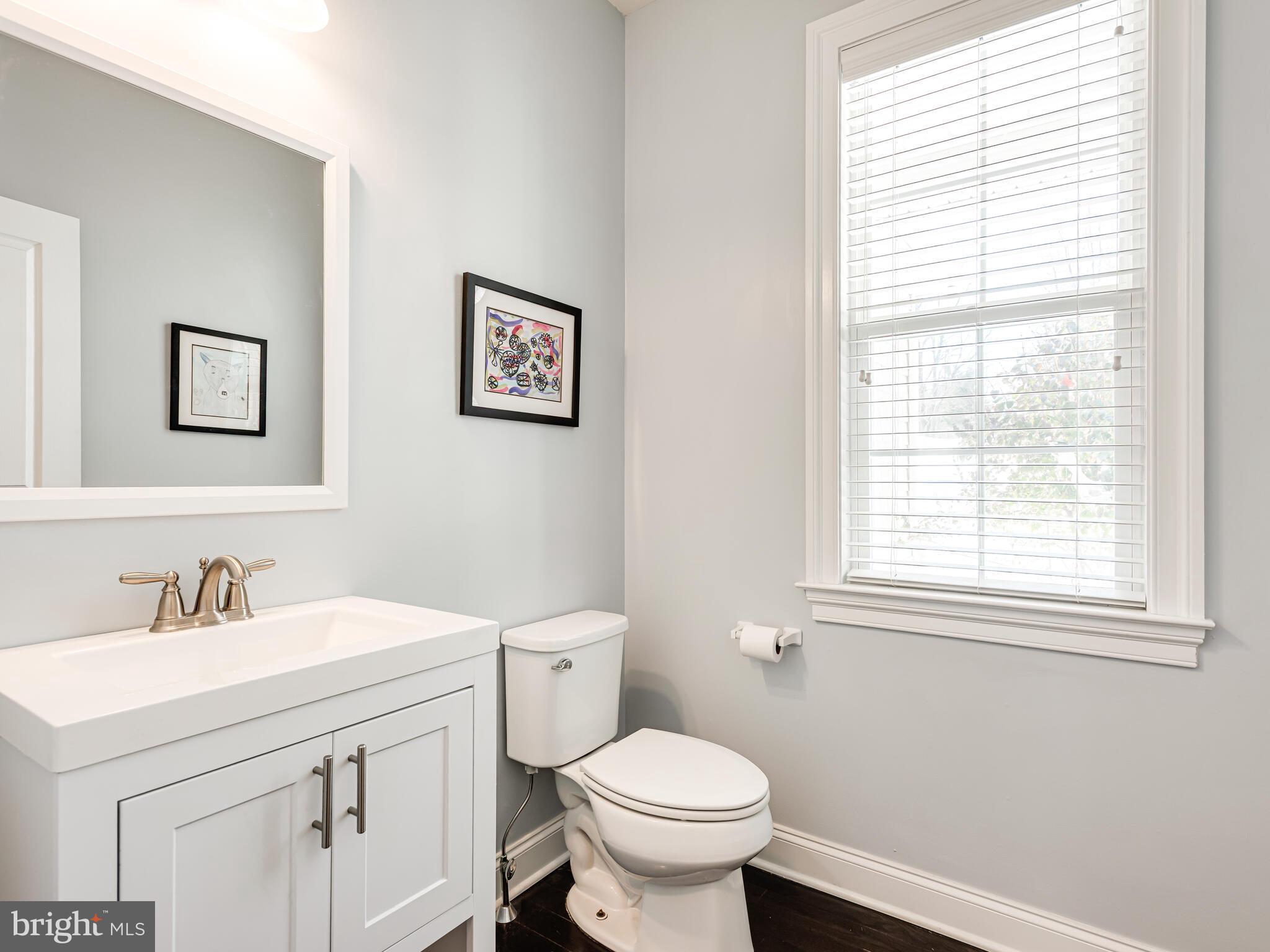 1718 Bethel Road Garnet Valley, PA 19060 - Photo 17 of 58 a bathroom with a toilet sink and mirror