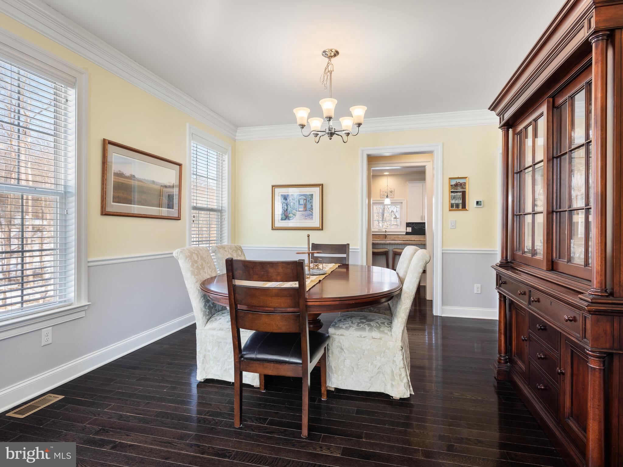 1718 Bethel Road Garnet Valley, PA 19060 - Photo 20 of 58 a view of a dining room with furniture a chandelier and wooden floor