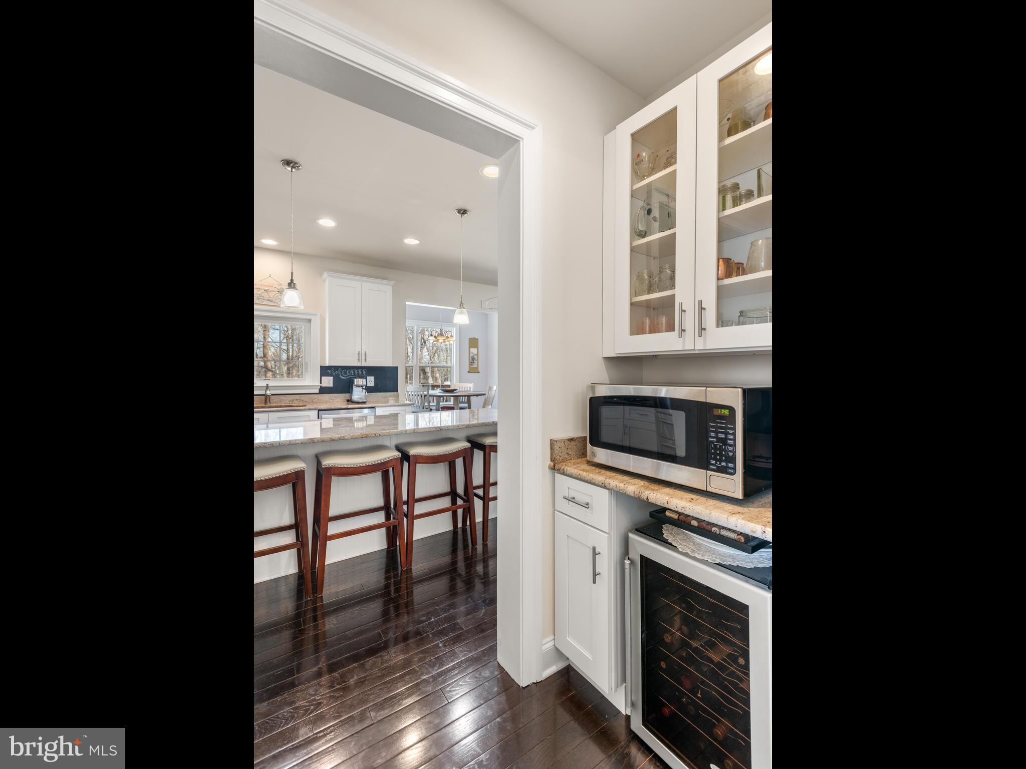 1718 Bethel Road Garnet Valley, PA 19060 - Photo 22 of 58 a kitchen with a stove a sink and a microwave