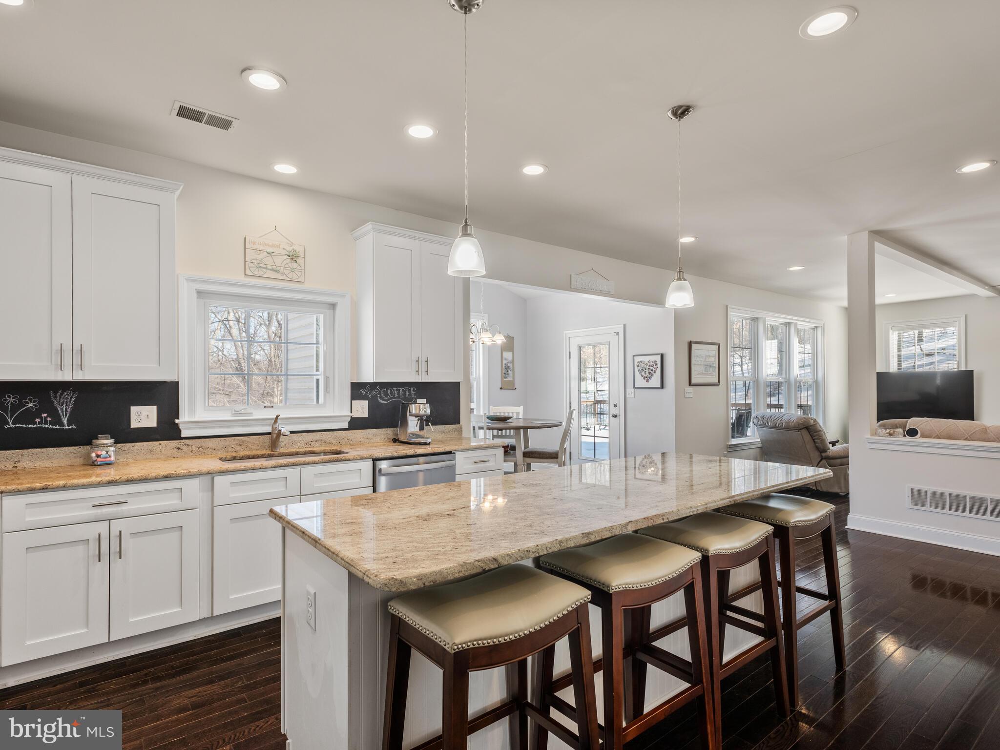 1718 Bethel Road Garnet Valley, PA 19060 - Photo 23 of 58 a kitchen with granite countertop a table and chairs in it