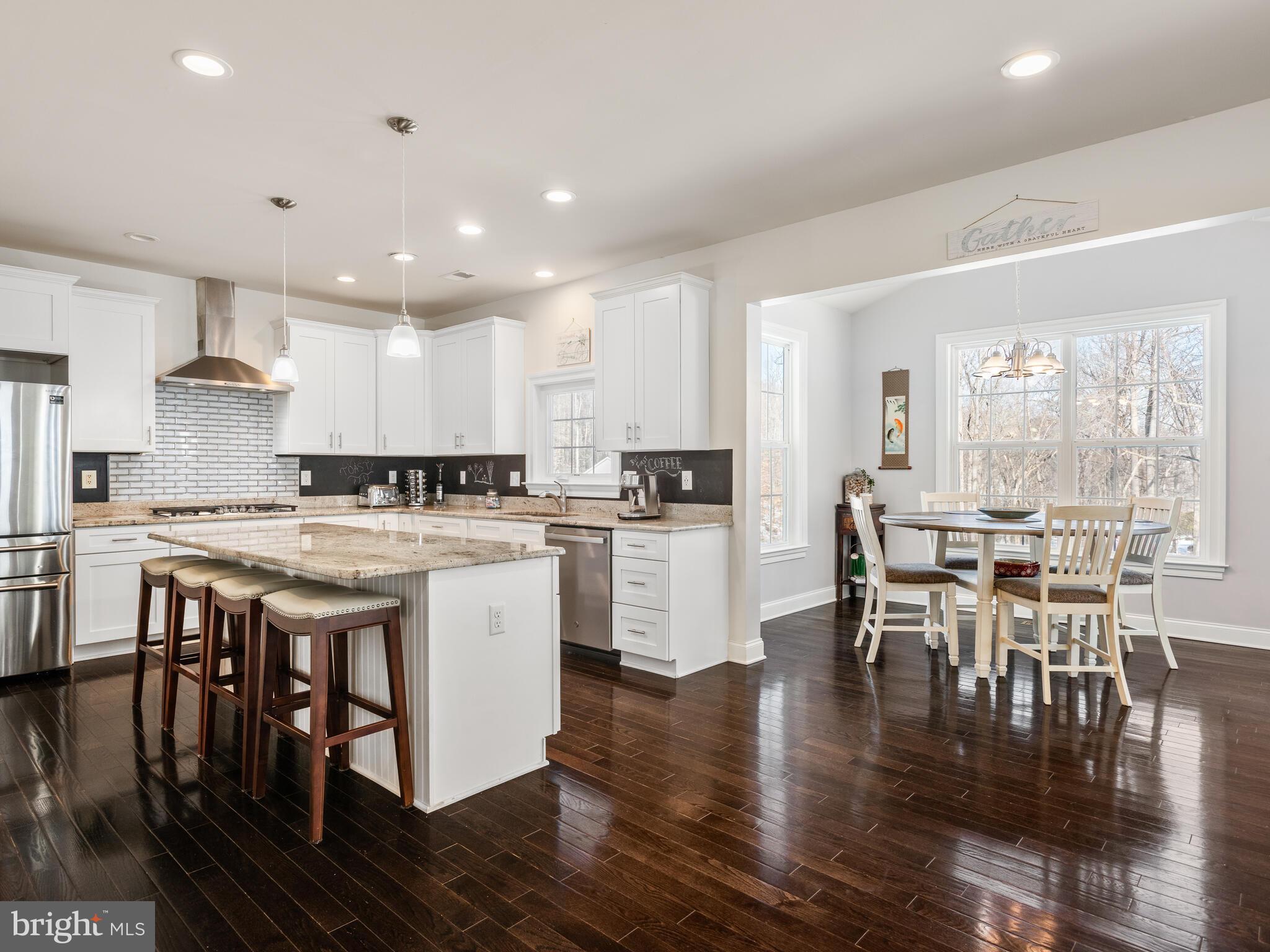 1718 Bethel Road Garnet Valley, PA 19060 - Photo 25 of 58 a kitchen with a table chairs stove and cabinets