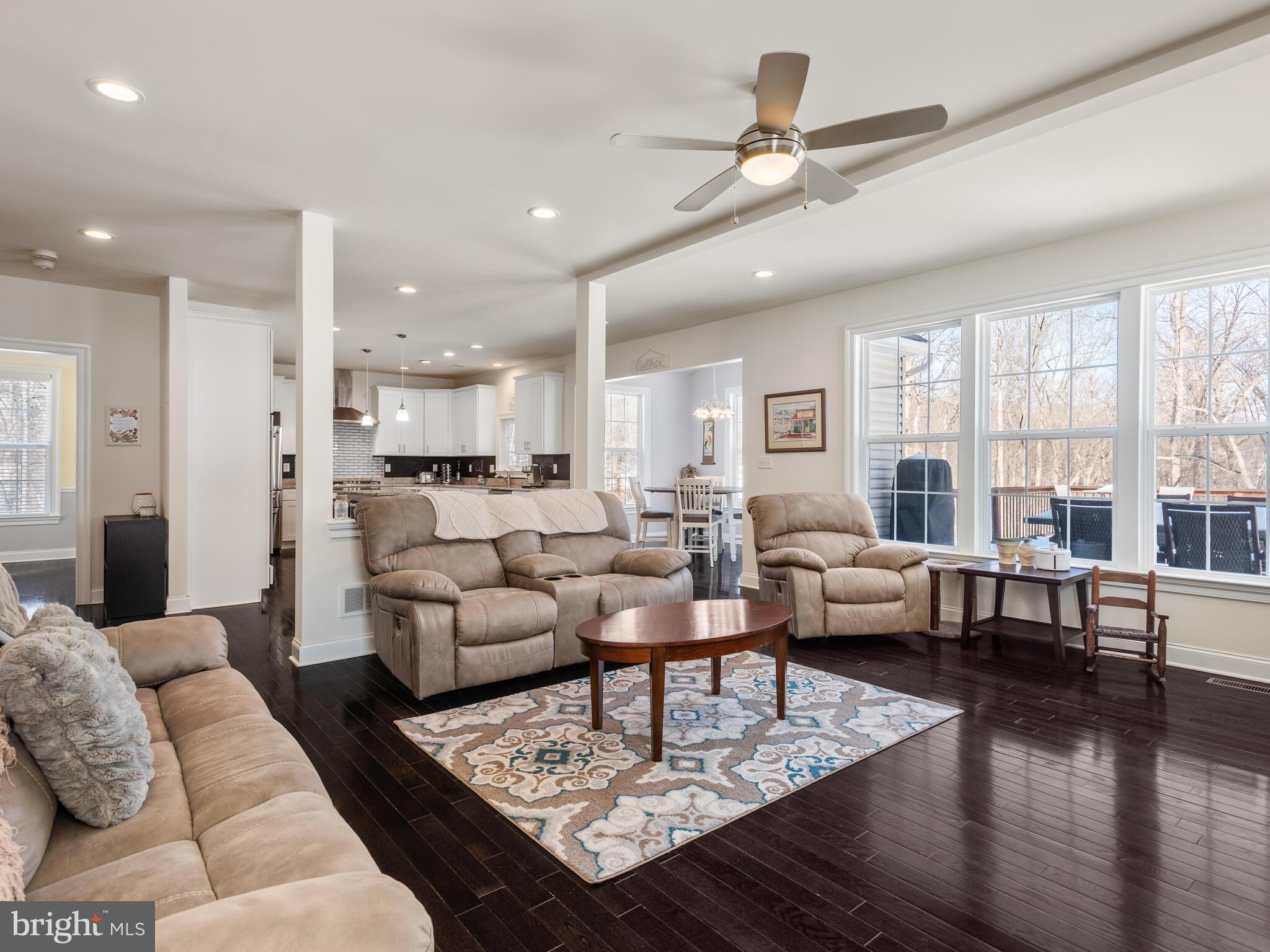 1718 Bethel Road Garnet Valley, PA 19060 - Photo 29 of 58 a living room with furniture wooden floor and a table