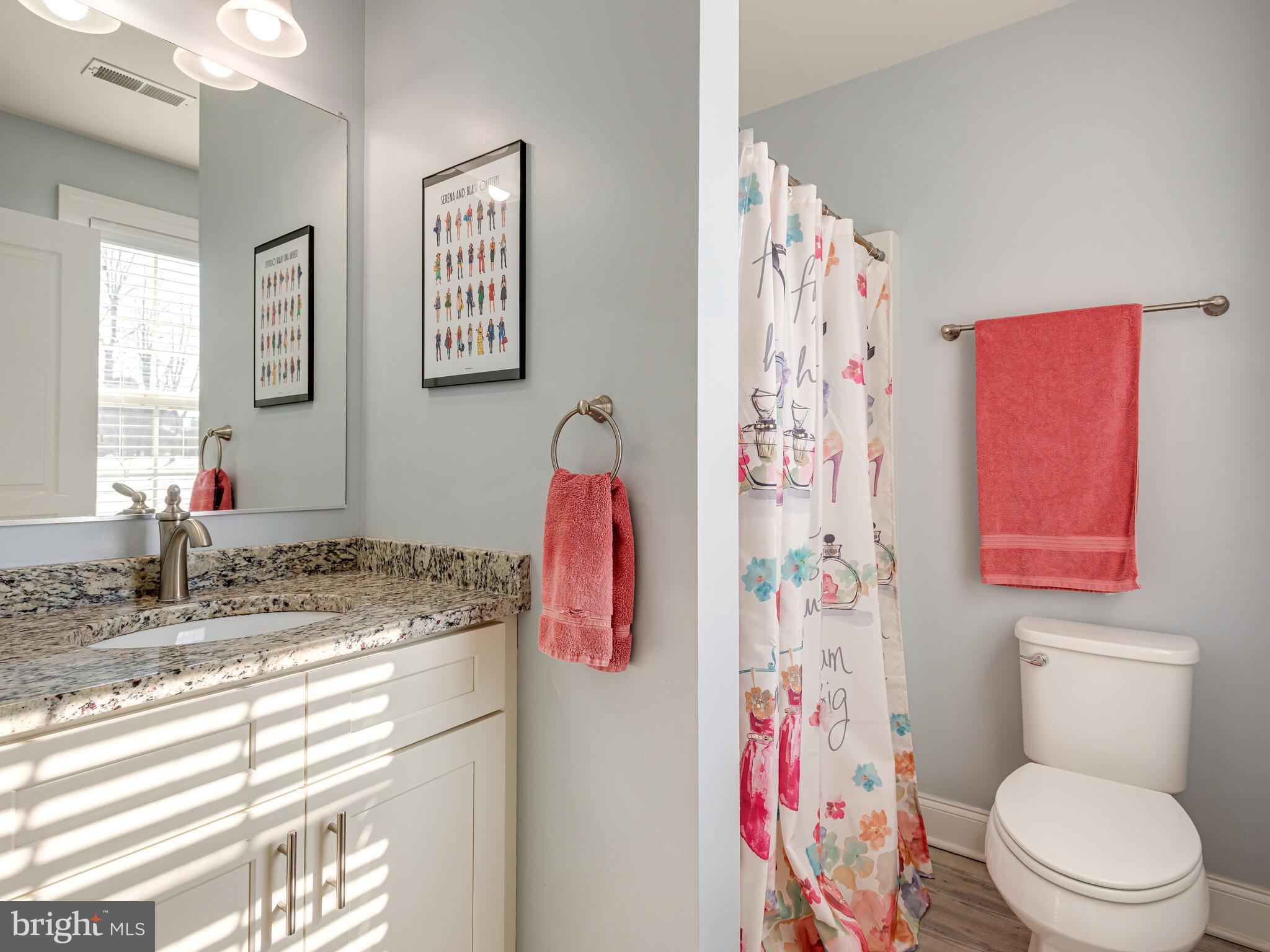 1718 Bethel Road Garnet Valley, PA 19060 - Photo 43 of 58 a bathroom with a sink a toilet and shower curtain