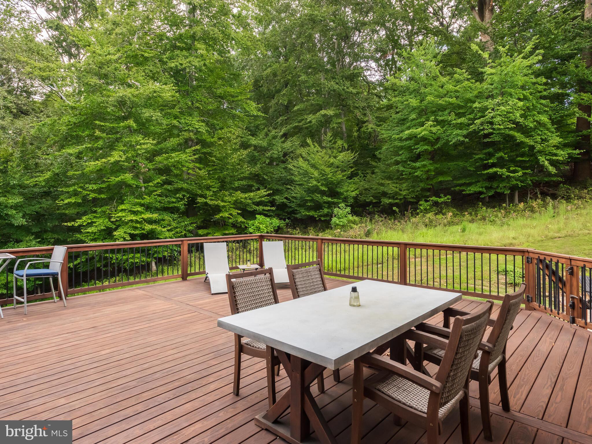 1718 Bethel Road Garnet Valley, PA 19060 - Photo 5 of 58 a view of a dinning tables and chairs in deck
