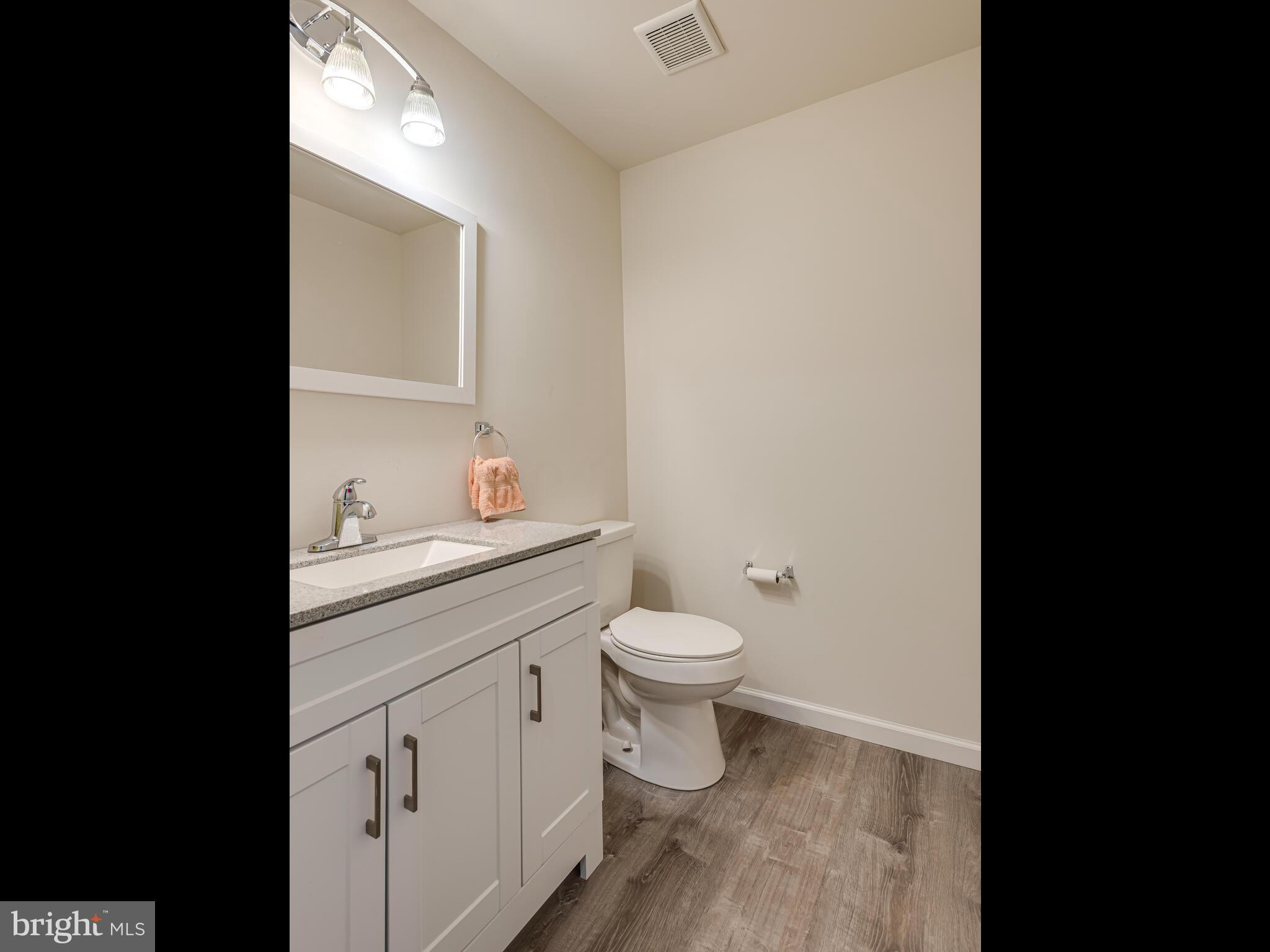 1718 Bethel Road Garnet Valley, PA 19060 - Photo 52 of 58 a bathroom with a toilet a sink a vanity and mirror