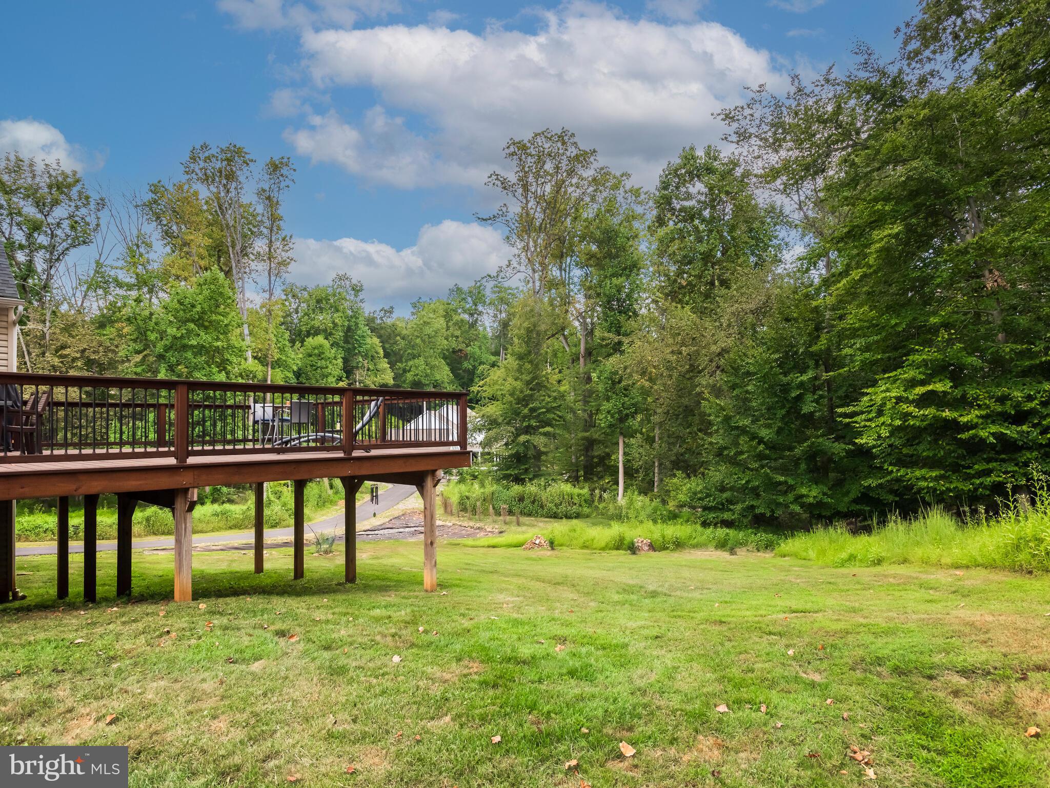 1718 Bethel Road Garnet Valley, PA 19060 - Photo 54 of 58 a view of a bench in the garden near a lake