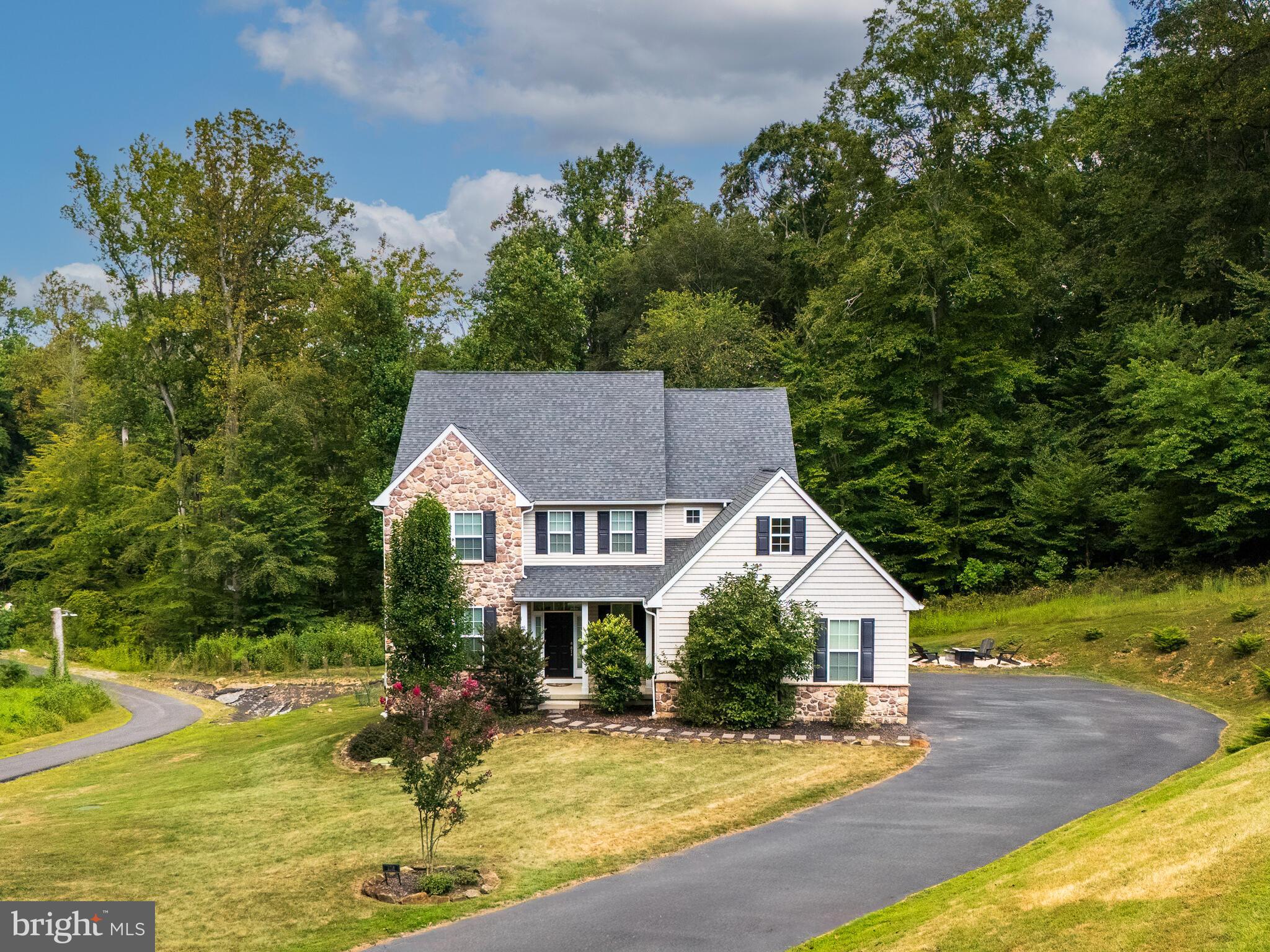 1718 Bethel Road Garnet Valley, PA 19060 - Photo 55 of 58 a front view of a house with garden