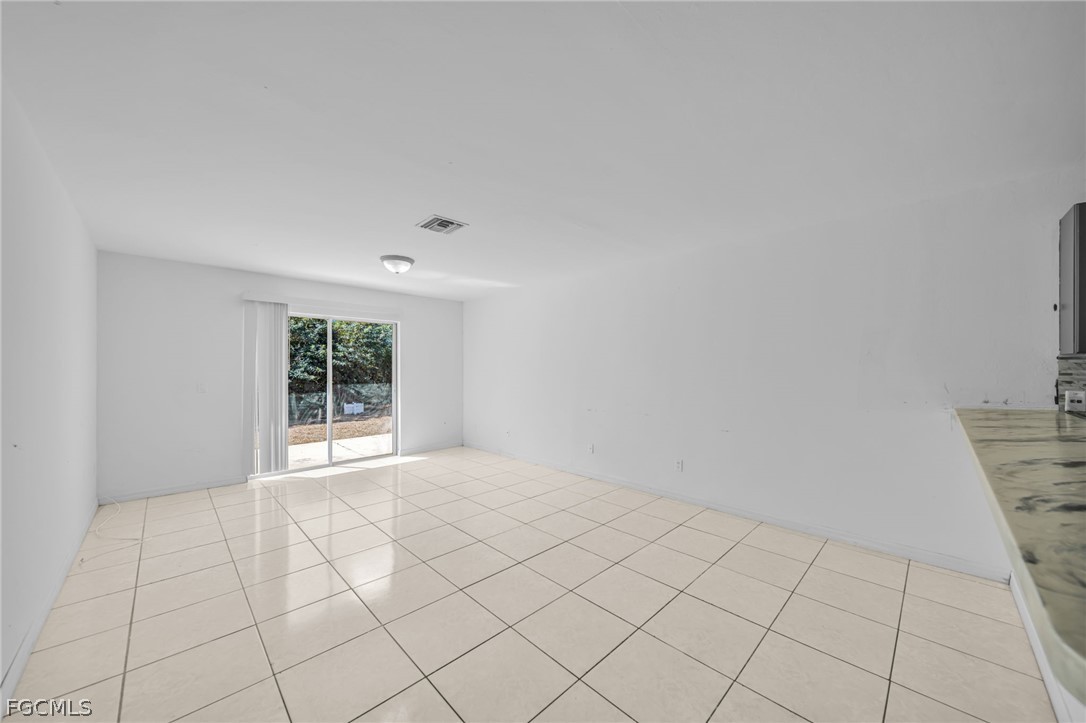 4549 22nd Street Southwest Lehigh Acres, FL 33973 - Photo 16 of 27 a view of an empty room and window
