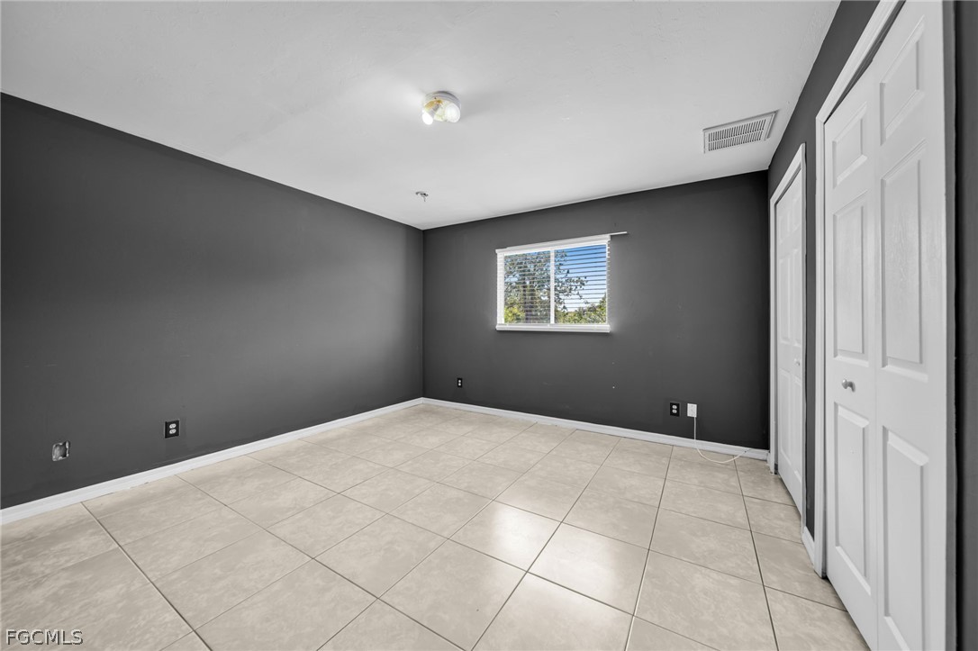 4549 22nd Street Southwest Lehigh Acres, FL 33973 - Photo 18 of 27 a view of an empty room with a window