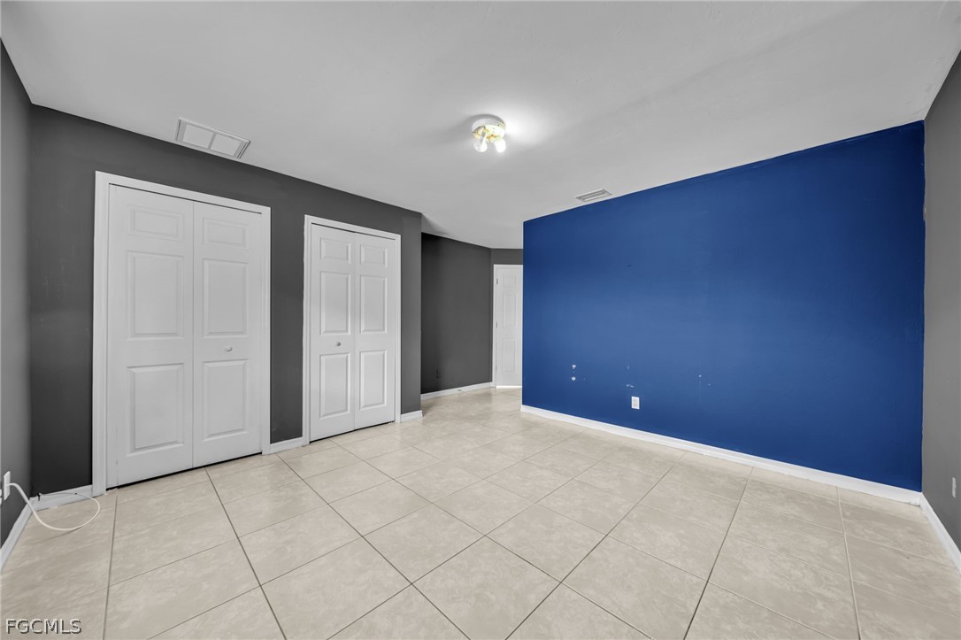 4549 22nd Street Southwest Lehigh Acres, FL 33973 - Photo 19 of 27 a view of an empty room
