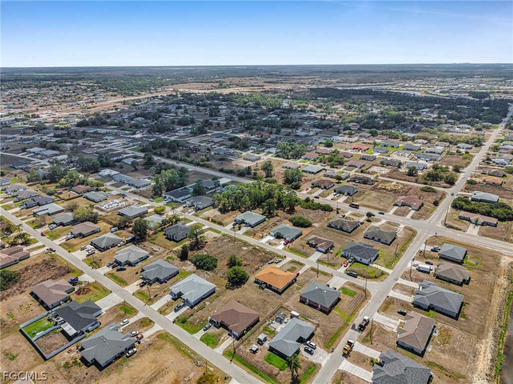 4549 22nd Street Southwest Lehigh Acres, FL 33973 - Photo 23 of 27 an aerial view of residential building and parking space