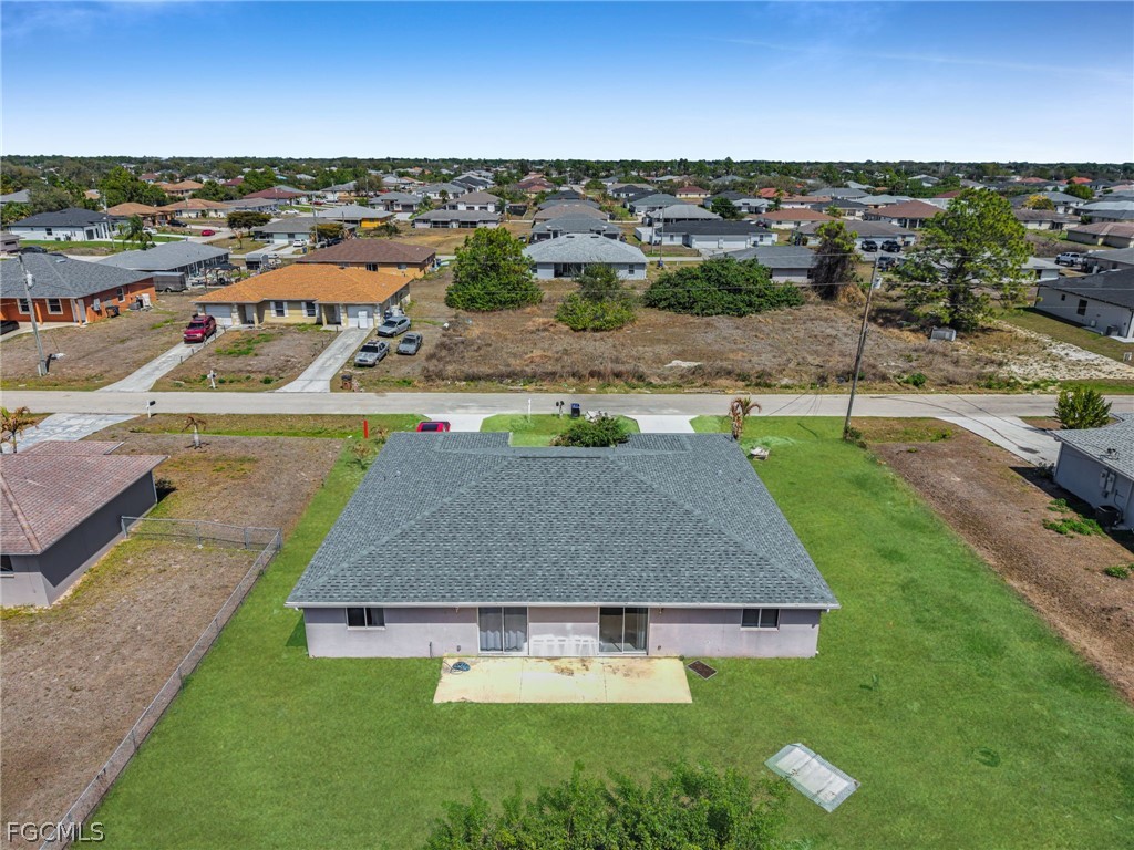 4549 22nd Street Southwest Lehigh Acres, FL 33973 - Photo 25 of 27 an aerial view of residential houses with outdoor space