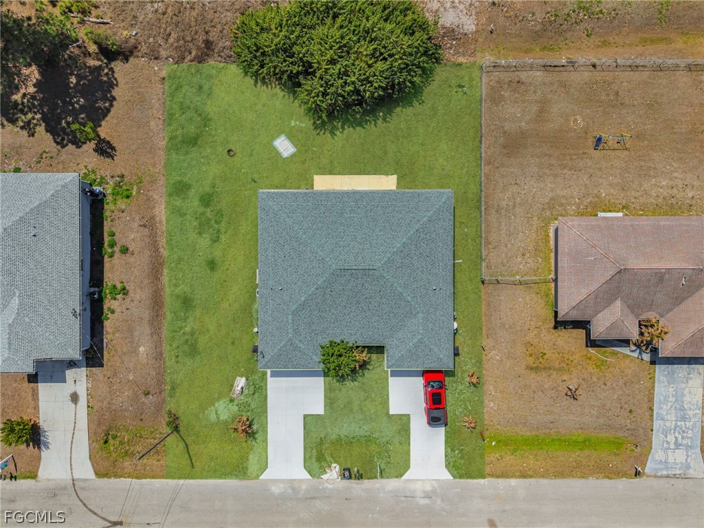 4549 22nd Street Southwest Lehigh Acres, FL 33973 - Photo 27 of 27 an aerial view of a house