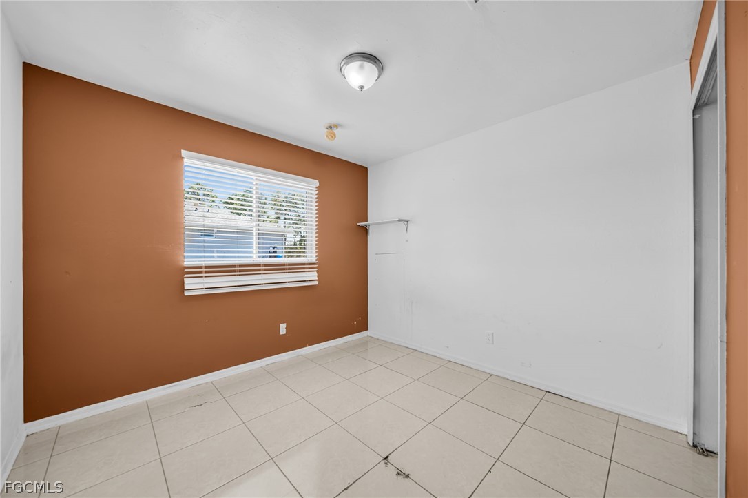 4549 22nd Street Southwest Lehigh Acres, FL 33973 - Photo 9 of 27 a view of an empty room with a window