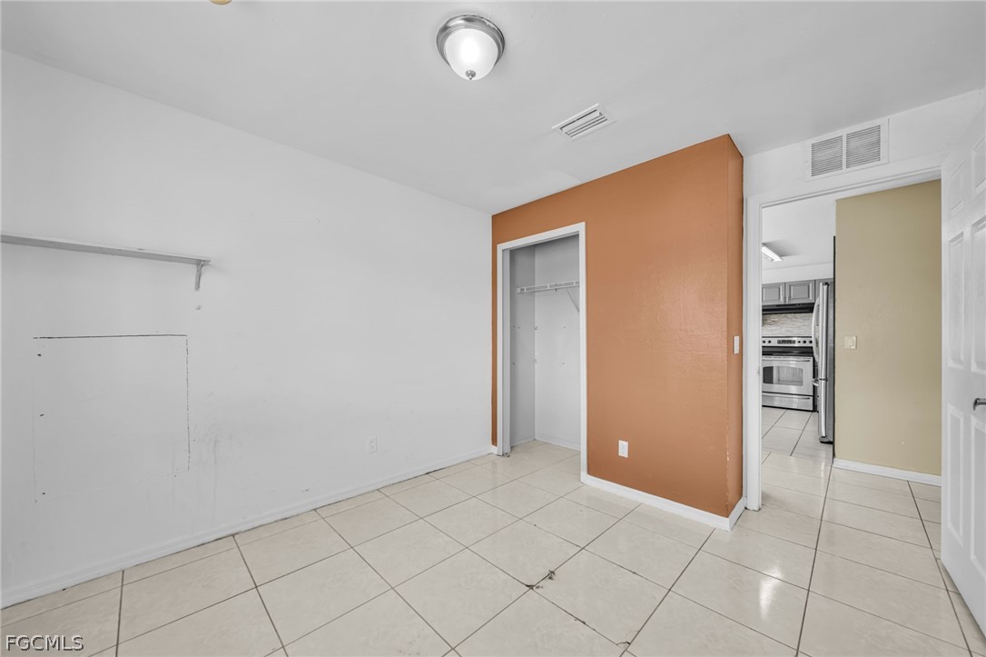 4549 22nd Street Southwest Lehigh Acres, FL 33973 - Photo 10 of 27 an empty room with closet