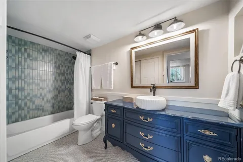 a bathroom with a bathtub and shower