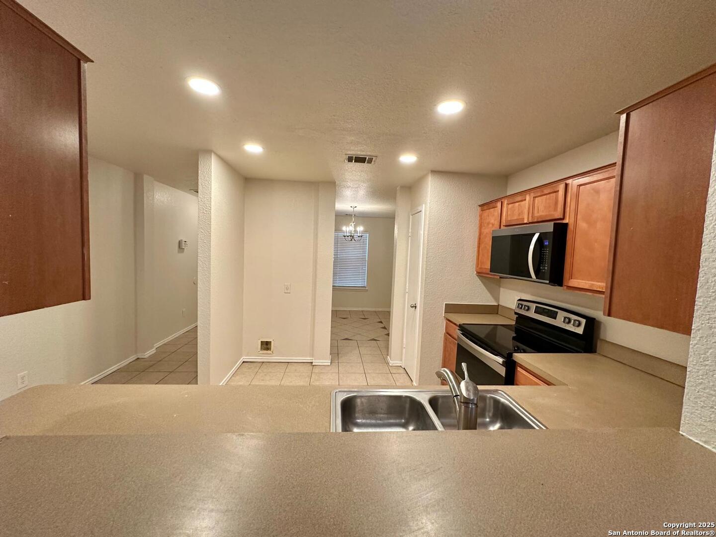 9414 Ingleton San Antonio, TX 78245 - Photo 2 of 17 a view of a livingroom with furniture and a flat screen tv