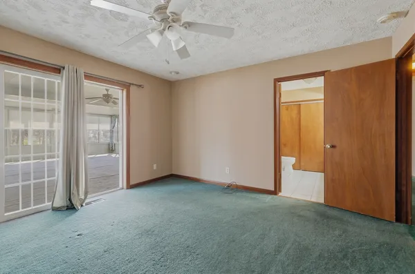 an empty room with a empty space and a window
