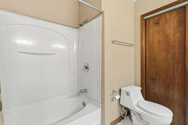 a bathroom with a granite countertop double vanity sink and a mirror