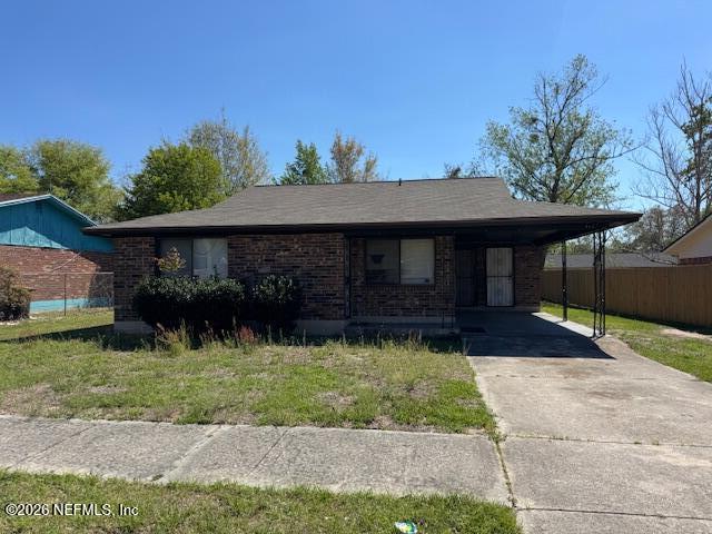4368 Bedivere Road Jacksonville, FL 32208 - Photo 1 of 20 a front view of a house with a yard