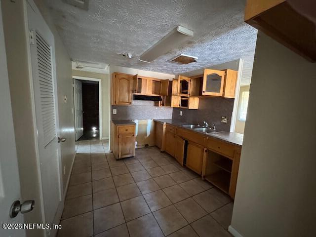 4368 Bedivere Road Jacksonville, FL 32208 - Photo 14 of 20 a kitchen with stainless steel appliances granite countertop a sink and cabinets