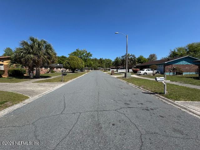 4368 Bedivere Road Jacksonville, FL 32208 - Photo 19 of 20 a view of a swimming pool and a yard