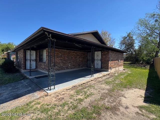 4368 Bedivere Road Jacksonville, FL 32208 - Photo 2 of 20 a front view of house with a garden