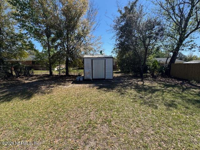 4368 Bedivere Road Jacksonville, FL 32208 - Photo 4 of 20 a view of a backyard with large trees