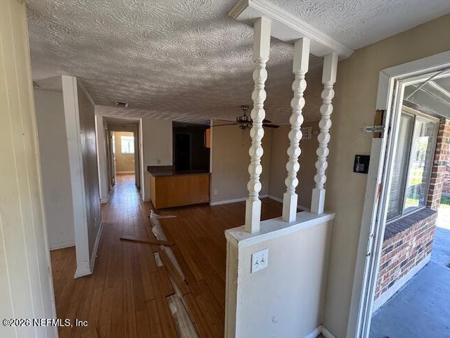 4368 Bedivere Road Jacksonville, FL 32208 - Photo 6 of 20 a view of entryway and hall with wooden floor