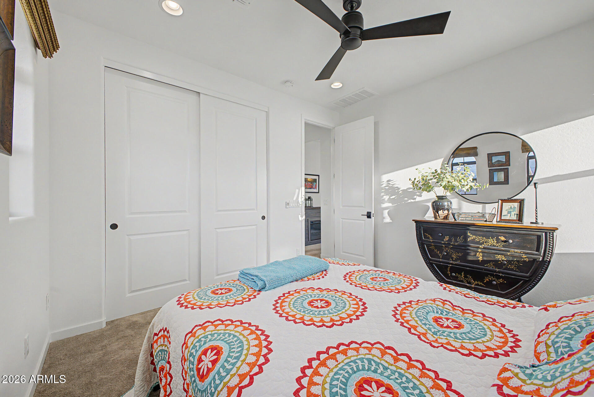 819 West Deer Creek Road Phoenix, AZ 85048 - Photo 49 of 76 a bedroom with a bed a dresser and potted plant
