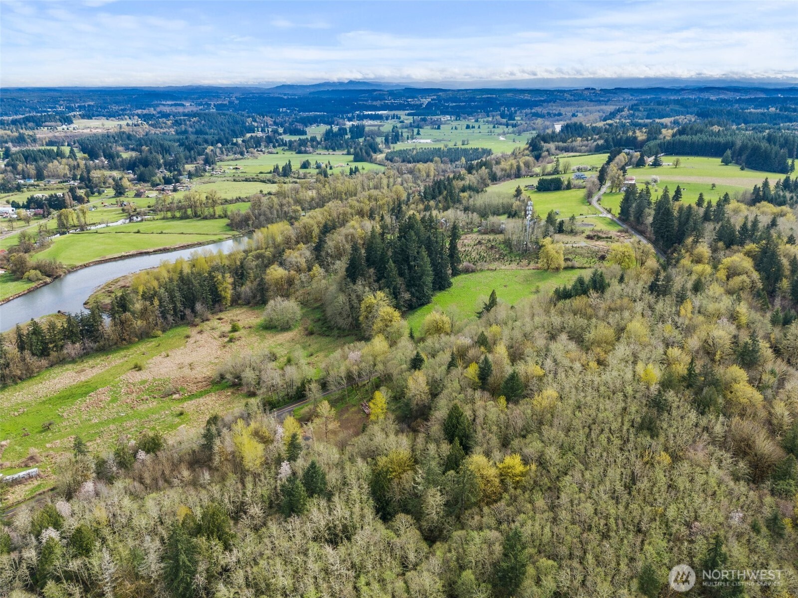 10931 Lundeen Road Southwest Rochester, WA 98579 - Photo 7 of 14 an aerial view of residential houses with outdoor space and trees