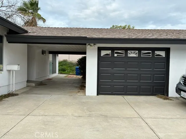 a view of house with backyard