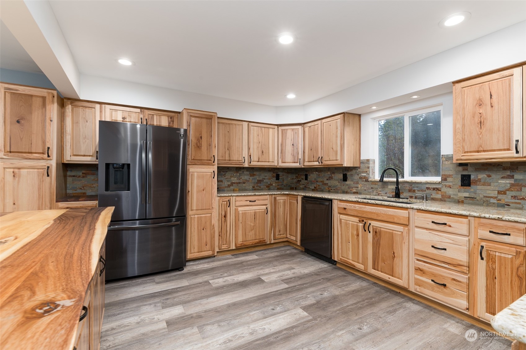 8120 Delta Line Road Custer, WA 98240 - Photo 12 of 40 a kitchen with granite countertop a refrigerator stove top oven and sink