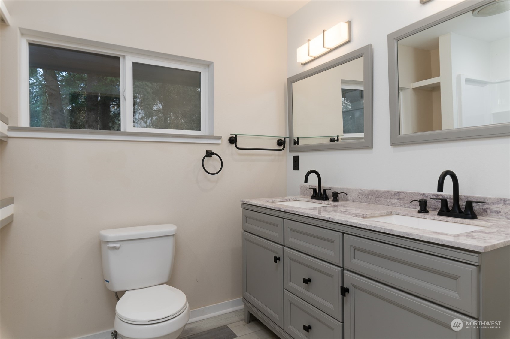 8120 Delta Line Road Custer, WA 98240 - Photo 15 of 40 a bathroom with a toilet sink and mirror