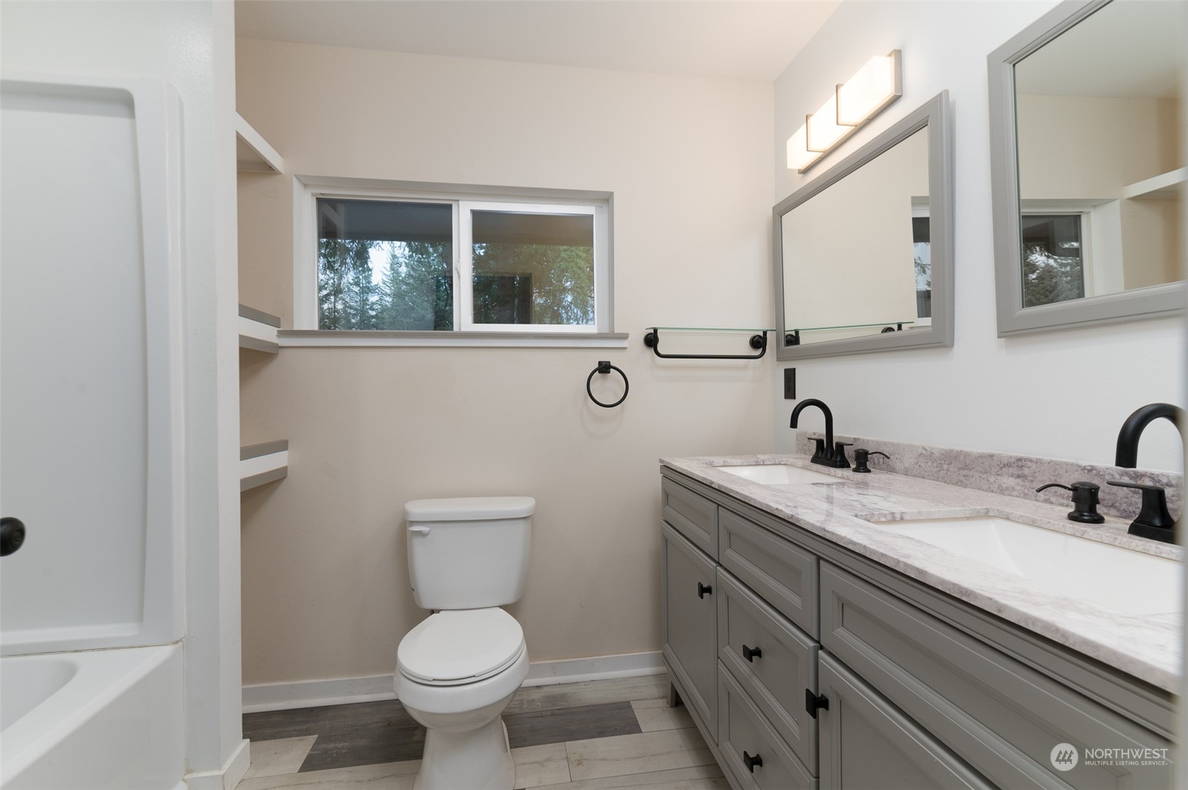 8120 Delta Line Road Custer, WA 98240 - Photo 16 of 40 a bathroom with a toilet sink and mirror