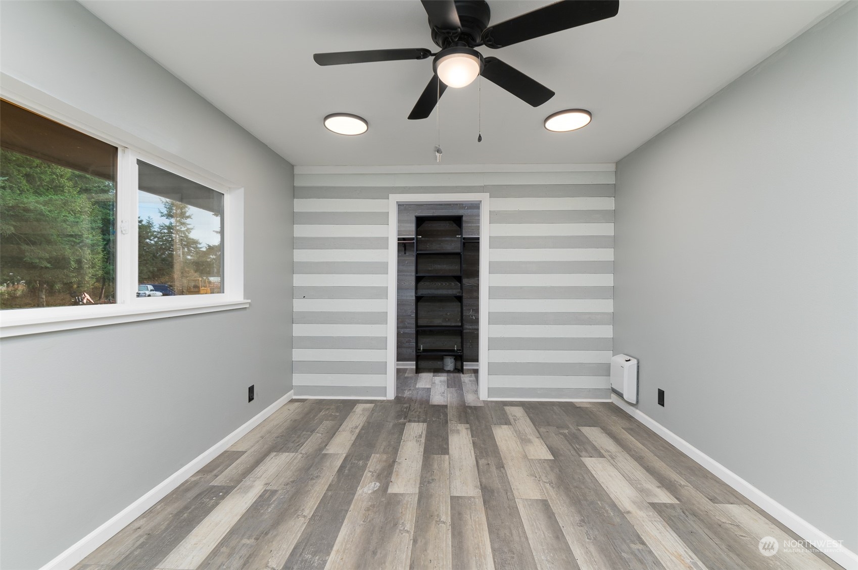 8120 Delta Line Road Custer, WA 98240 - Photo 17 of 40 a view of a bedroom with closet and ceiling fan