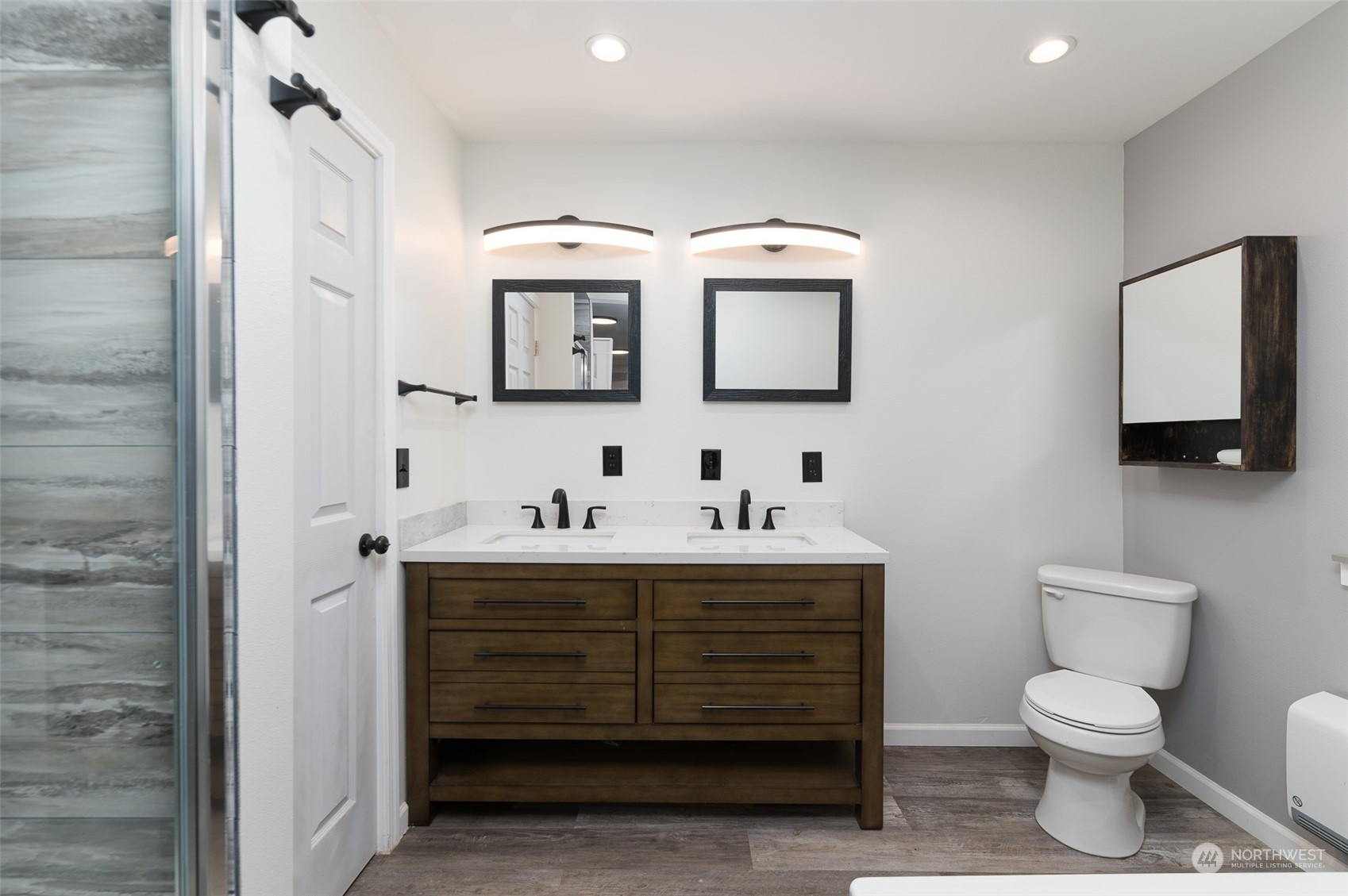 8120 Delta Line Road Custer, WA 98240 - Photo 18 of 40 a bathroom with a toilet sink and mirror