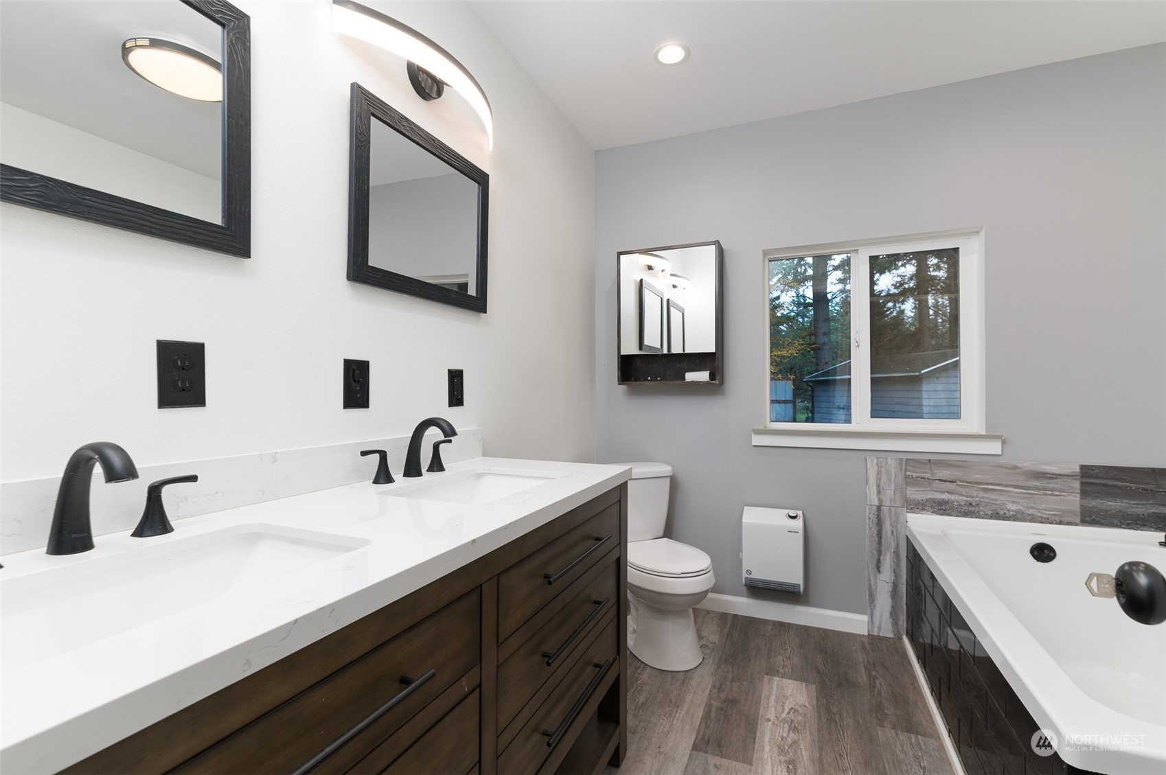 8120 Delta Line Road Custer, WA 98240 - Photo 20 of 40 a bathroom with a sink and a large mirror