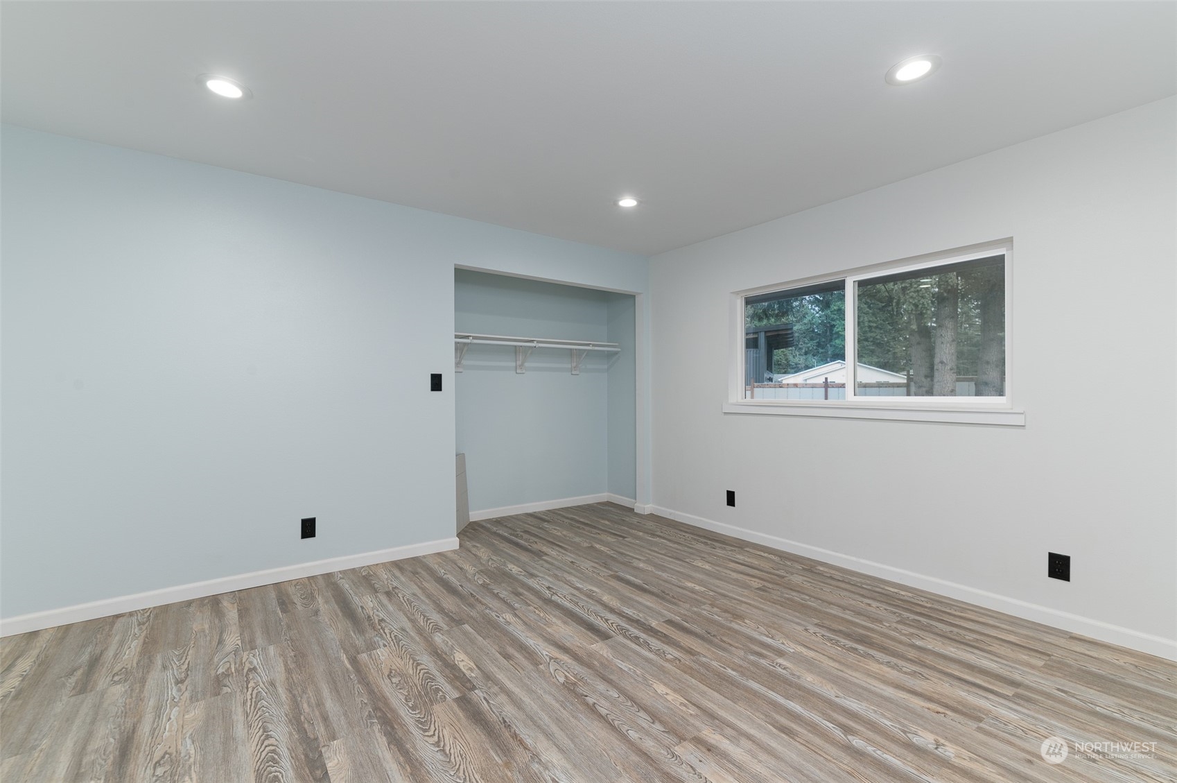 8120 Delta Line Road Custer, WA 98240 - Photo 21 of 40 a view of empty room with wooden floor and fan