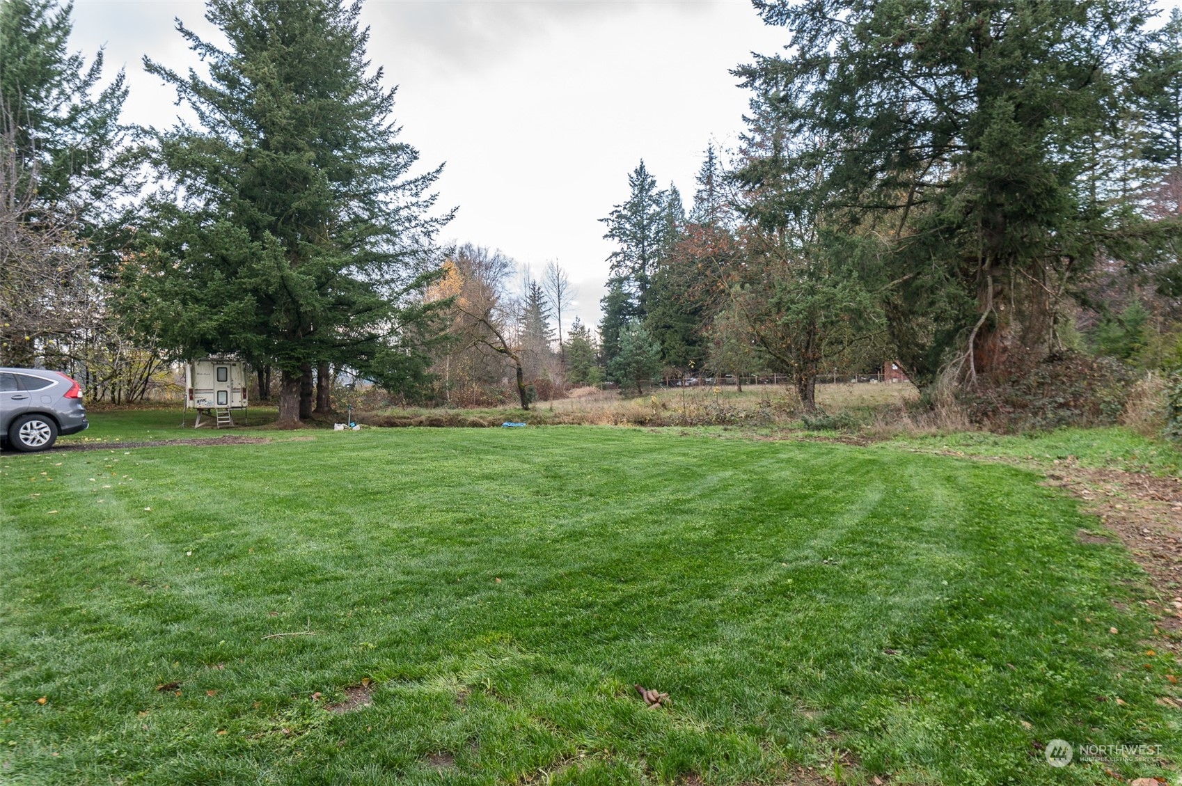 8120 Delta Line Road Custer, WA 98240 - Photo 32 of 40 a view of outdoor space with deck and yard