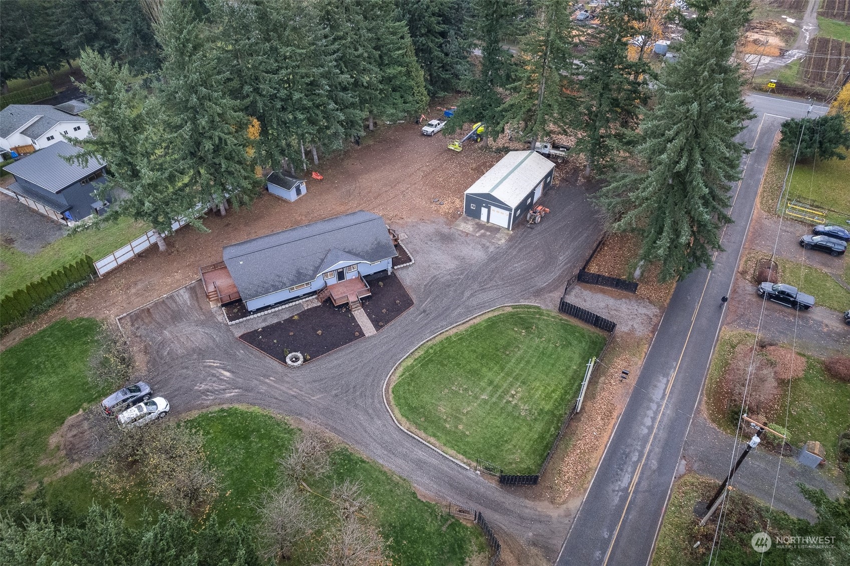 8120 Delta Line Road Custer, WA 98240 - Photo 40 of 40 an aerial view of a house with a yard and lake