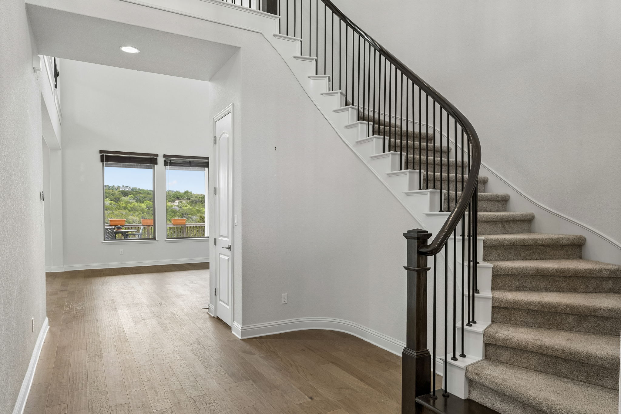 7212 Celebration Court Leander, TX 78645 - Photo 12 of 39 a view of entryway with wooden floor and stairs