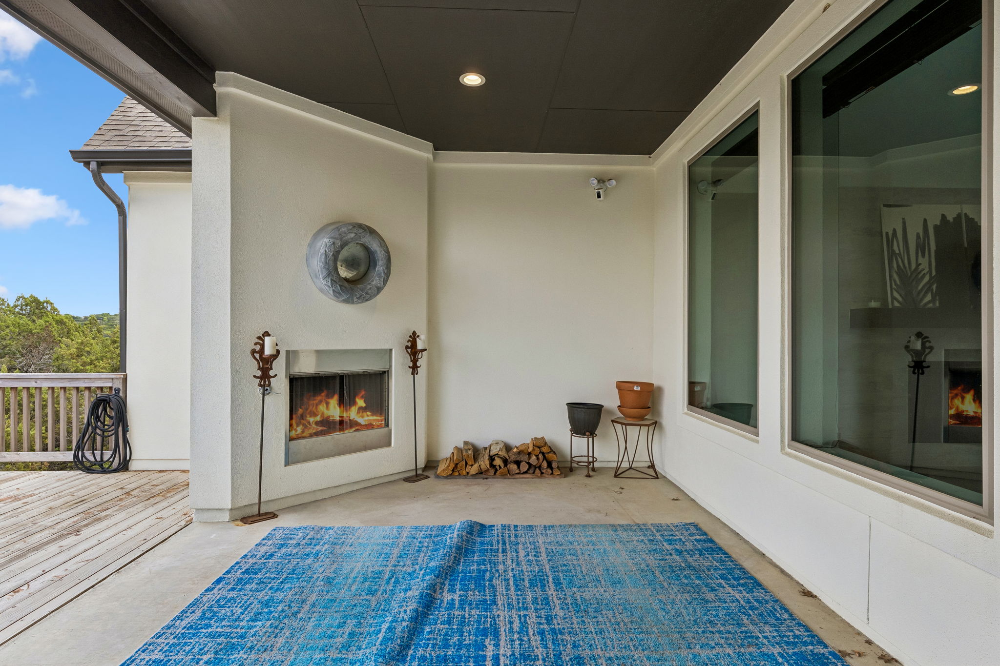 7212 Celebration Court Leander, TX 78645 - Photo 23 of 39 a view of a hallway with wooden floor fireplace and windows