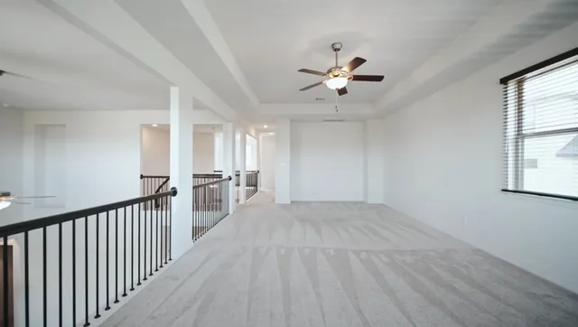 a living room with furniture and windows